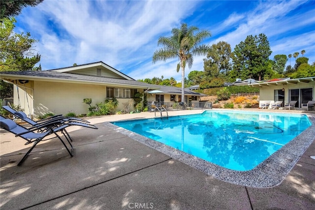 view of pool featuring a patio area