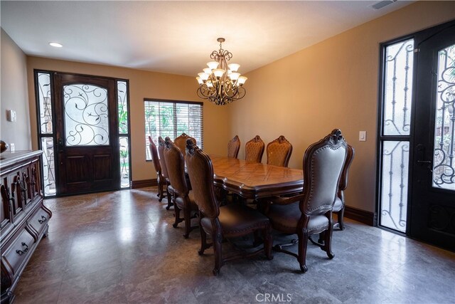 dining room featuring a notable chandelier