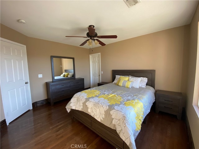 bedroom featuring dark hardwood / wood-style floors and ceiling fan