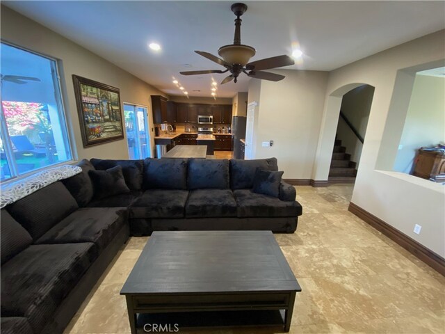 living room with ceiling fan