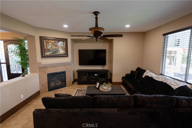 living room featuring light carpet and ceiling fan