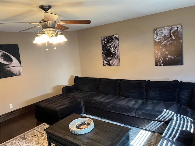living room featuring ceiling fan and hardwood / wood-style floors