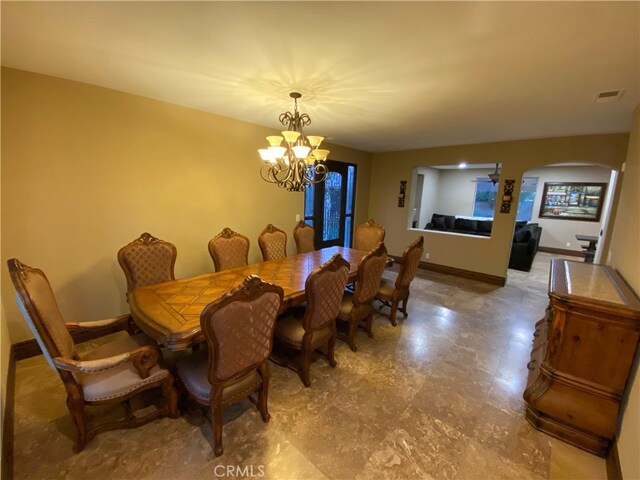 dining room featuring a notable chandelier