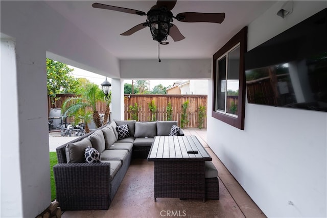 view of patio with outdoor lounge area and ceiling fan