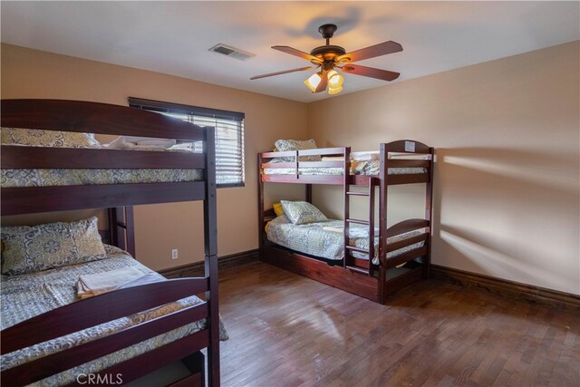 bedroom with hardwood / wood-style floors and ceiling fan