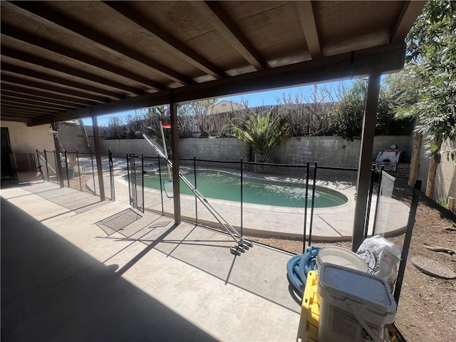 view of swimming pool with a patio area