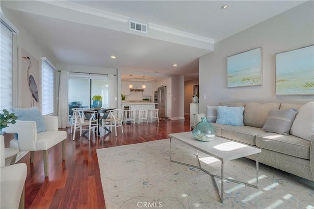 living room with dark hardwood / wood-style flooring