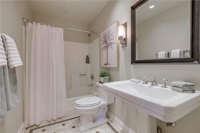 full bathroom with sink, toilet, shower / tub combo, and tile patterned flooring