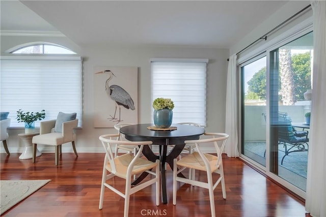 dining room with dark wood-type flooring