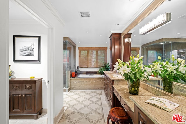 bathroom with ornamental molding, tile patterned floors, and a bathtub