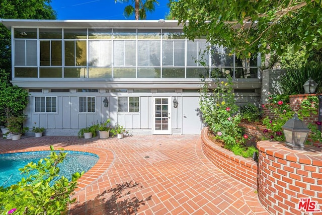 rear view of house featuring a patio