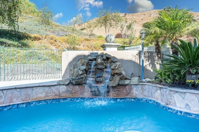 view of pool featuring a mountain view