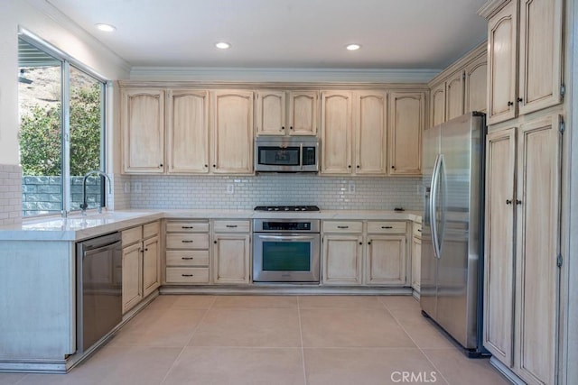 kitchen with sink, light brown cabinets, crown molding, light tile patterned flooring, and appliances with stainless steel finishes