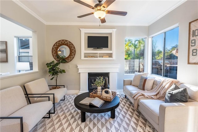 living room with ceiling fan and crown molding