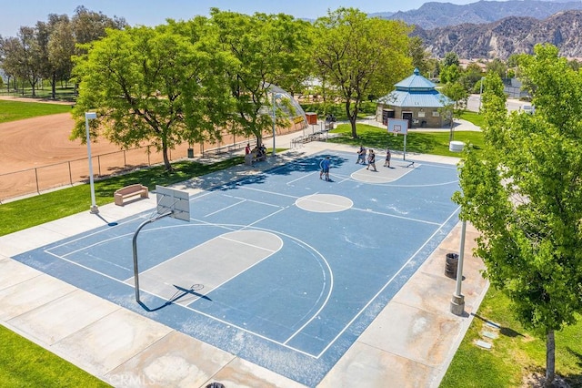 view of basketball court featuring a mountain view