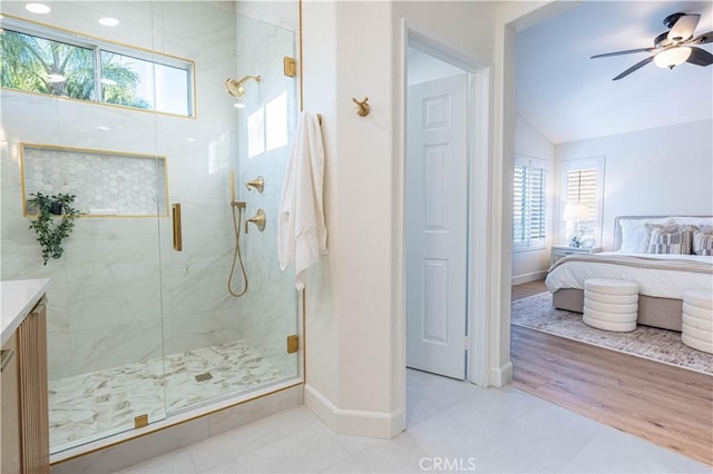 bathroom with hardwood / wood-style floors, ceiling fan, a healthy amount of sunlight, and a shower with shower door