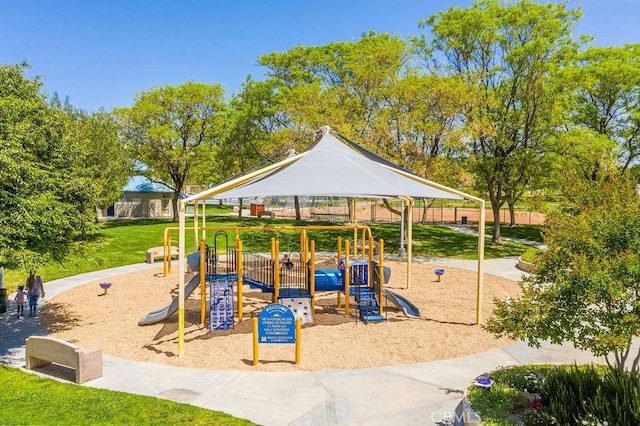 view of playground featuring a lawn