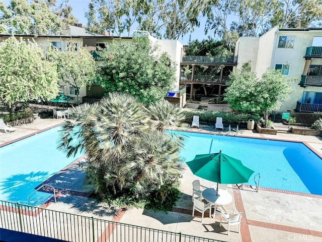 view of swimming pool with a patio