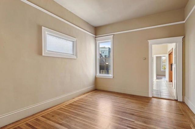 spare room featuring hardwood / wood-style flooring