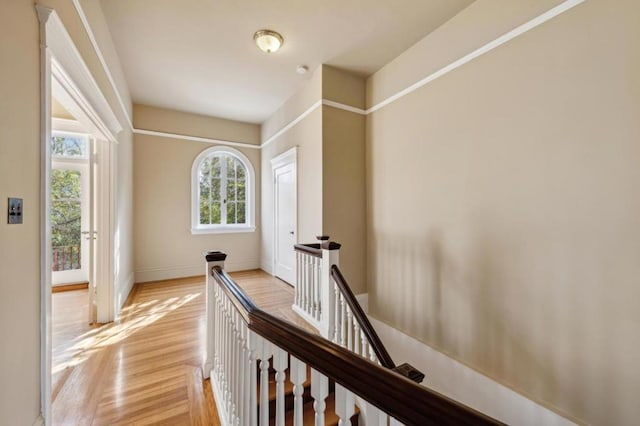 hall with light hardwood / wood-style floors