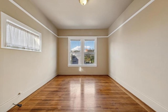 spare room featuring hardwood / wood-style flooring