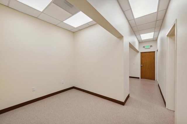 corridor featuring a paneled ceiling