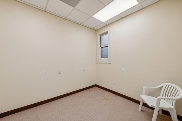 spare room with a paneled ceiling