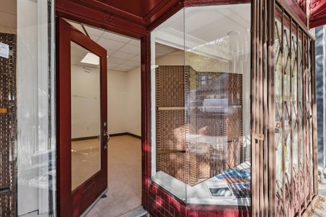 bathroom with a drop ceiling and french doors