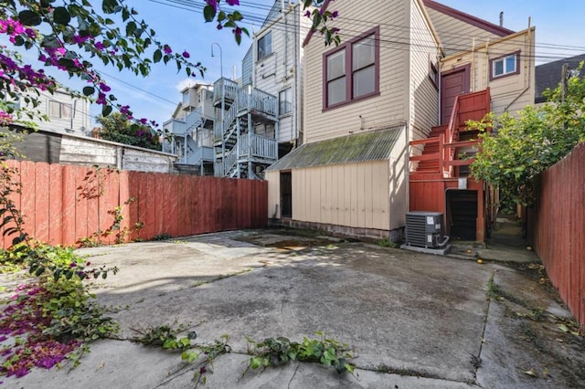 exterior space with a patio area and cooling unit