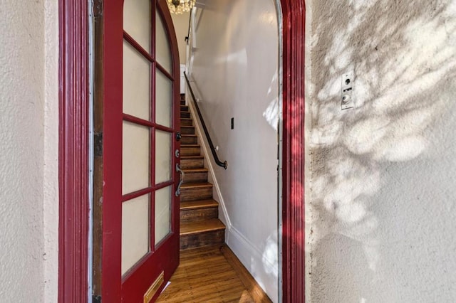 stairs featuring wood-type flooring