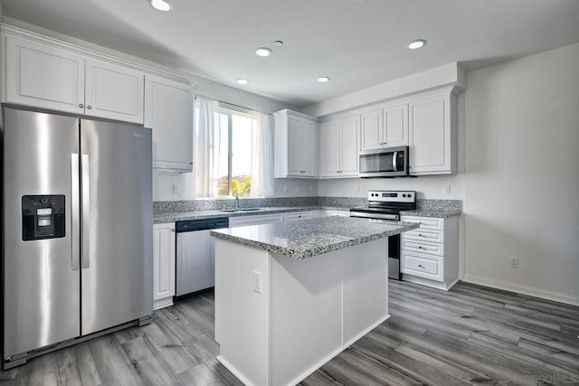 kitchen with white cabinetry and stainless steel appliances