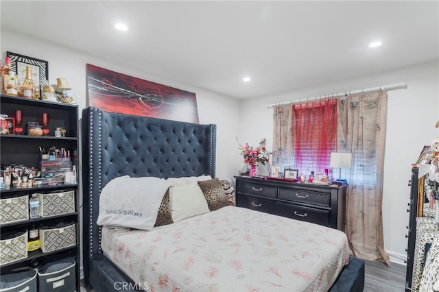 bedroom featuring recessed lighting and wood finished floors