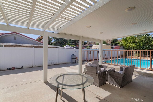 view of patio with a fenced in pool and a pergola