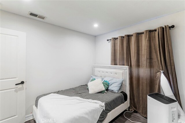 bedroom featuring wood-type flooring