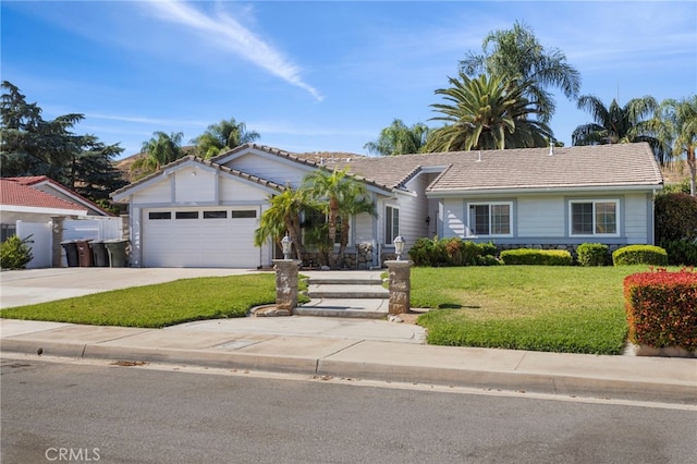 ranch-style home with an attached garage, concrete driveway, a tile roof, and a front yard