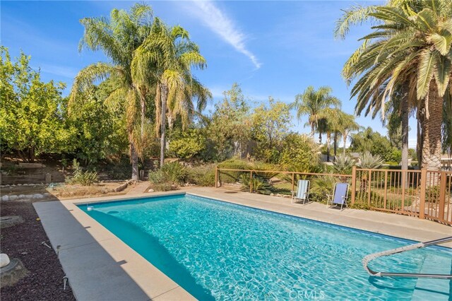 view of pool with a fenced in pool