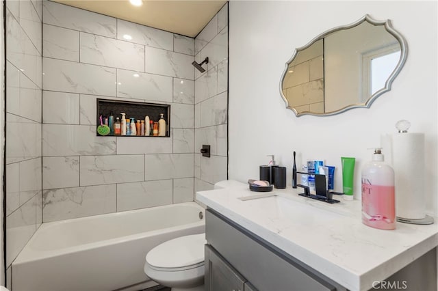 full bath with vanity, toilet, and shower / washtub combination