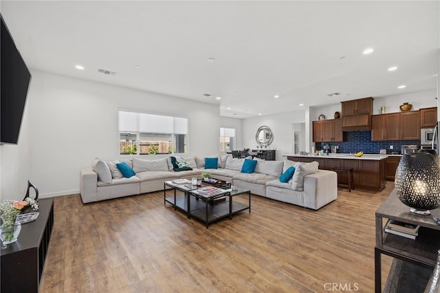 living room with light hardwood / wood-style flooring