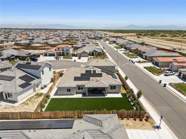 birds eye view of property with a mountain view