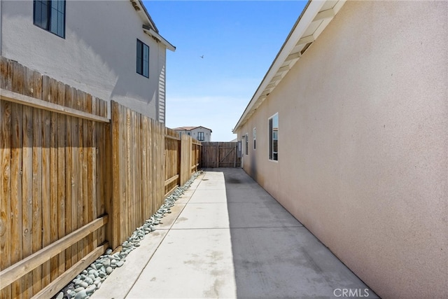 view of side of home featuring a patio