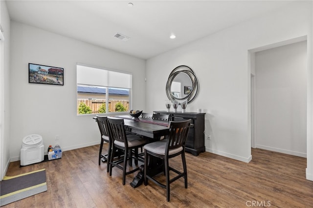 dining area with dark wood-type flooring