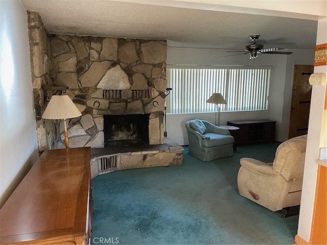 living room with carpet flooring, a healthy amount of sunlight, a fireplace, and a textured ceiling