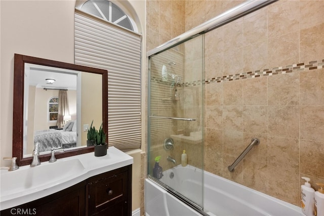 bathroom with vanity and combined bath / shower with glass door