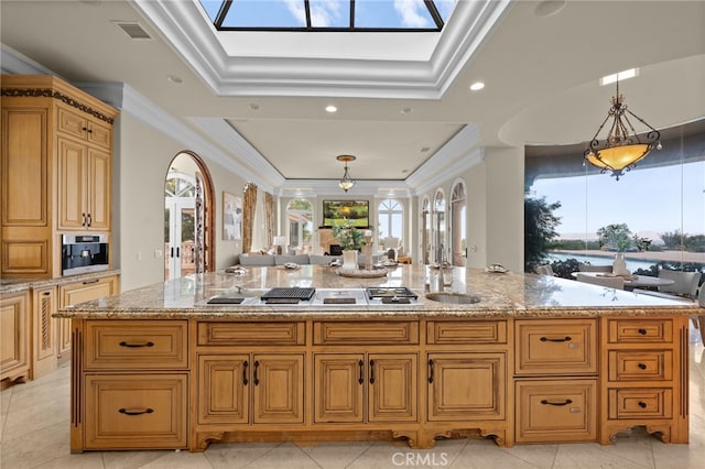 kitchen featuring a spacious island, crown molding, light tile patterned floors, and pendant lighting