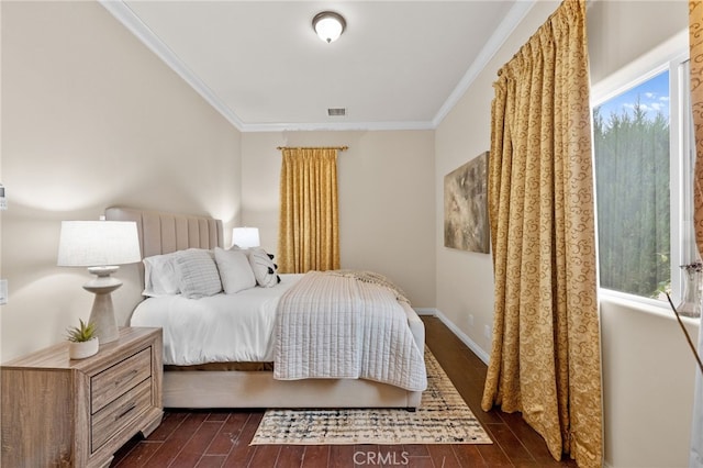 bedroom featuring dark hardwood / wood-style flooring and crown molding