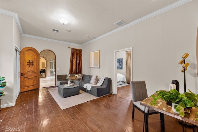 living room featuring crown molding and dark hardwood / wood-style flooring