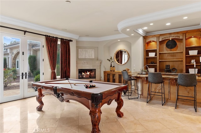 recreation room with french doors, crown molding, and pool table