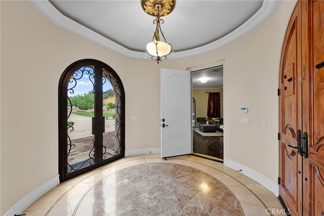 entryway with a tray ceiling