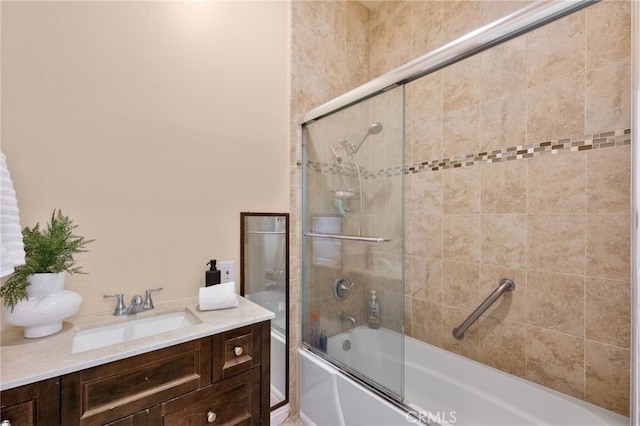 bathroom featuring vanity and enclosed tub / shower combo