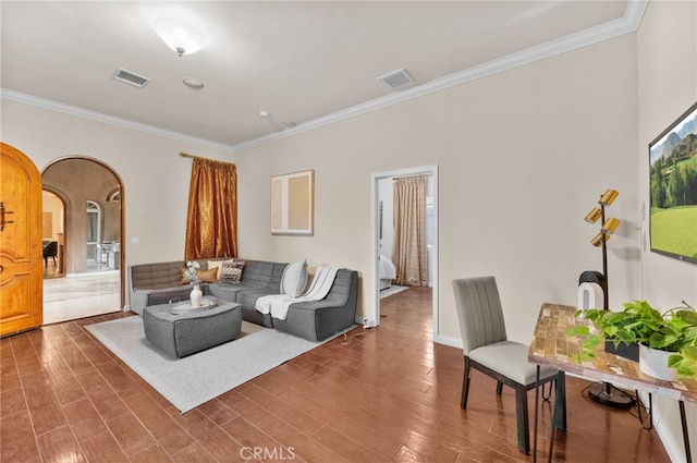 living room featuring dark hardwood / wood-style flooring and ornamental molding